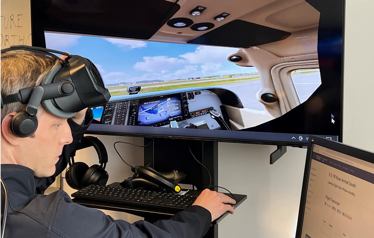 Man demonstrates flight simulator