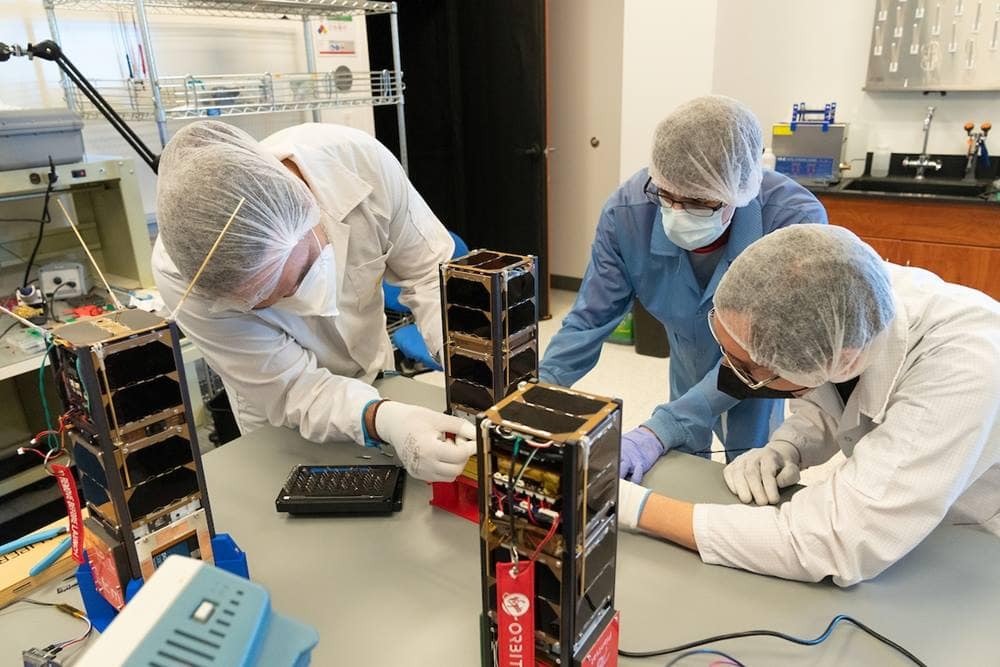 Students work on CubeSats bound for space.