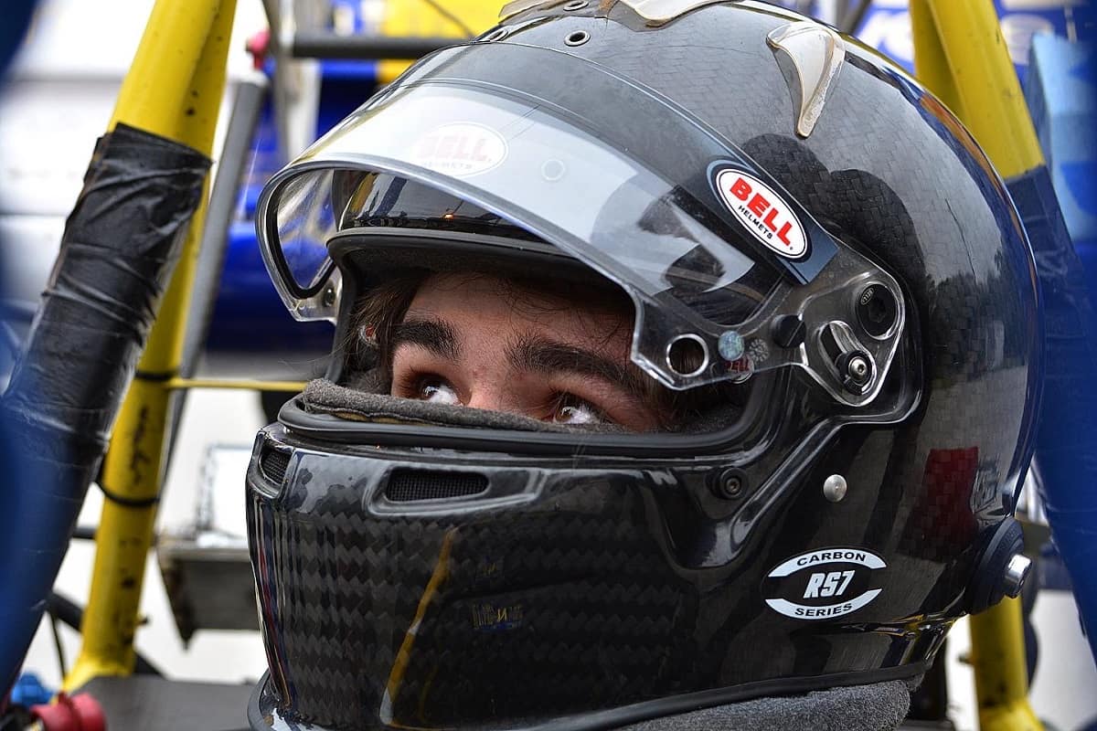 Race car driver in helmet.