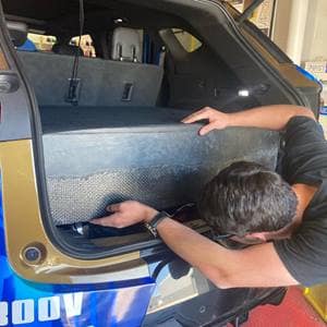 A student works on a car