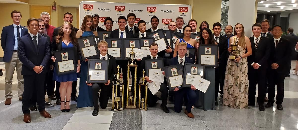 The Golden Eagles Flight Team at Embry‑Riddle’s Prescott Campus posing with trophies and awards.