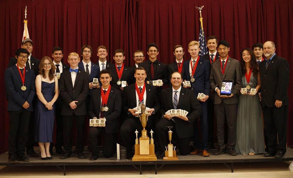 The Golden Eagles Flight Team from Embry‑Riddle’s Prescott Campus on stage holding awards.