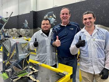 Two students and teacher give thumbs up at Intuitive Machines headquarters.