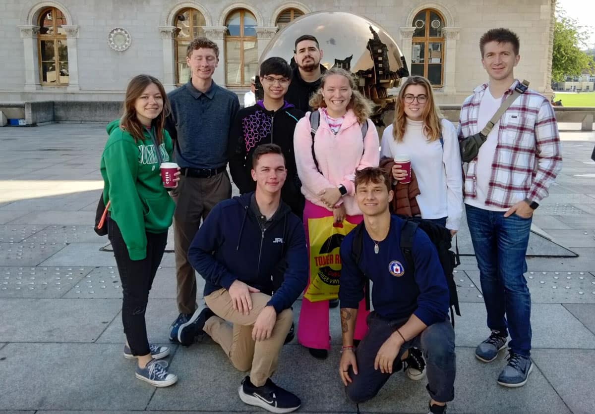 Students pose infront of a statue in Dubline, Ireland.