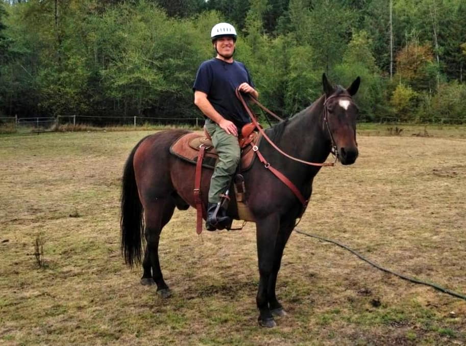 Man rides horse.