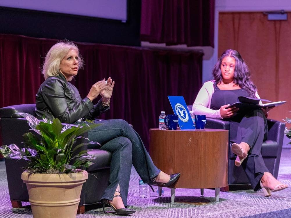 Student moderator Shyan Khalil (at right), a 2023 NTSB intern and president of the American Society of Safety Professionals group at Embry‑Riddle’s Daytona Beach, Florida, campus, prepared questions for the NTSB Chair. (Photo: Embry‑Riddle/David Massey)