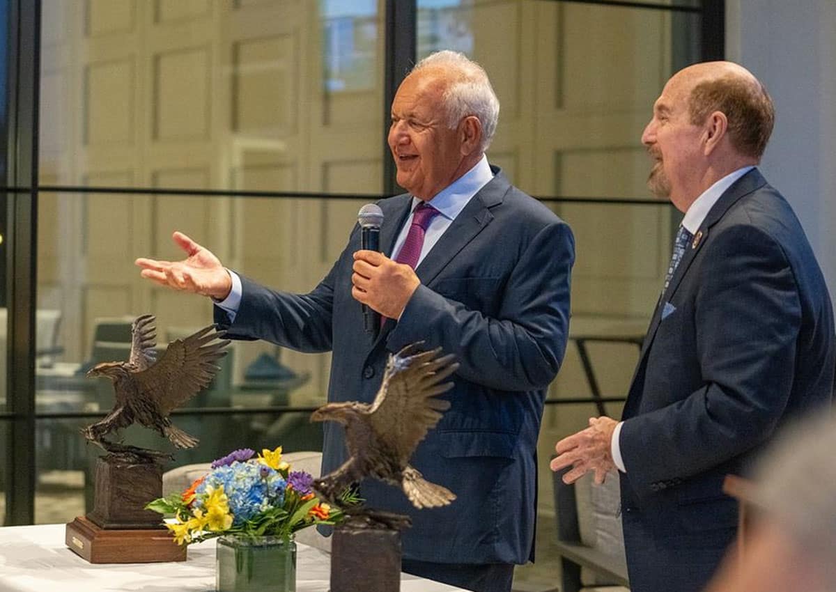 Embry‑Riddle Board of Trustees Chairman Mori Hosseini and trustee Ken Dufour were awarded Sky King statues for their 25 years of service to Embry‑Riddle Aeronautical University. (Photo: Embry‑Riddle/David Massey) 