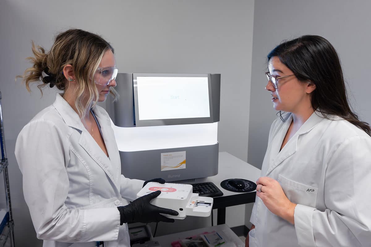 Dr. Amber Paul (right) works with Carol Mitchell, a student researcher in Paul's Omics Lab for Health and Human Performance who was a co-author on research published in a Nature compendium of space biology papers (Photo: Embry‑Riddle/Bernard Wilchusky)
