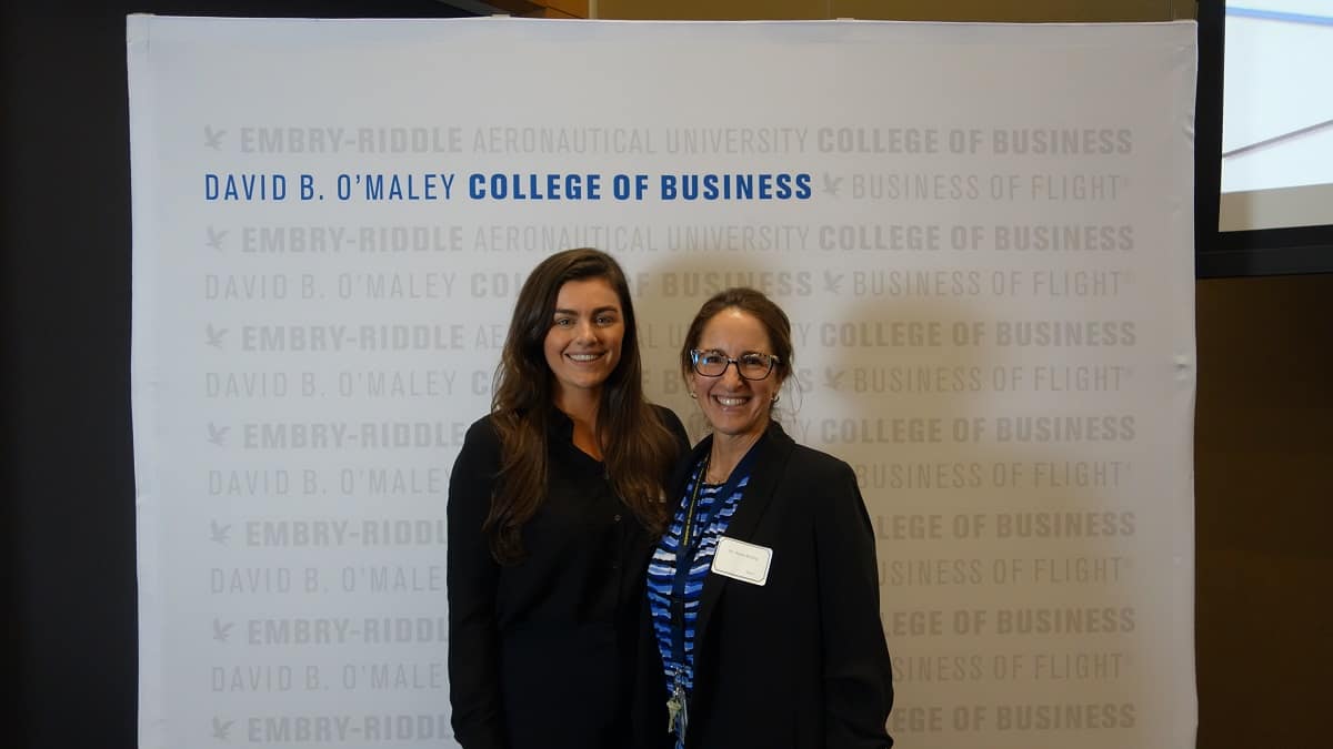Embry‑Riddle student Joan Dwyer (left), shown with her faculty mentor, Dr. Maria Rickling, had an opportunity to interact directly with Daytona Beach International Airport executives to learn how airports recruit new air carriers. (Photo: David B. O’Maley College of Business)