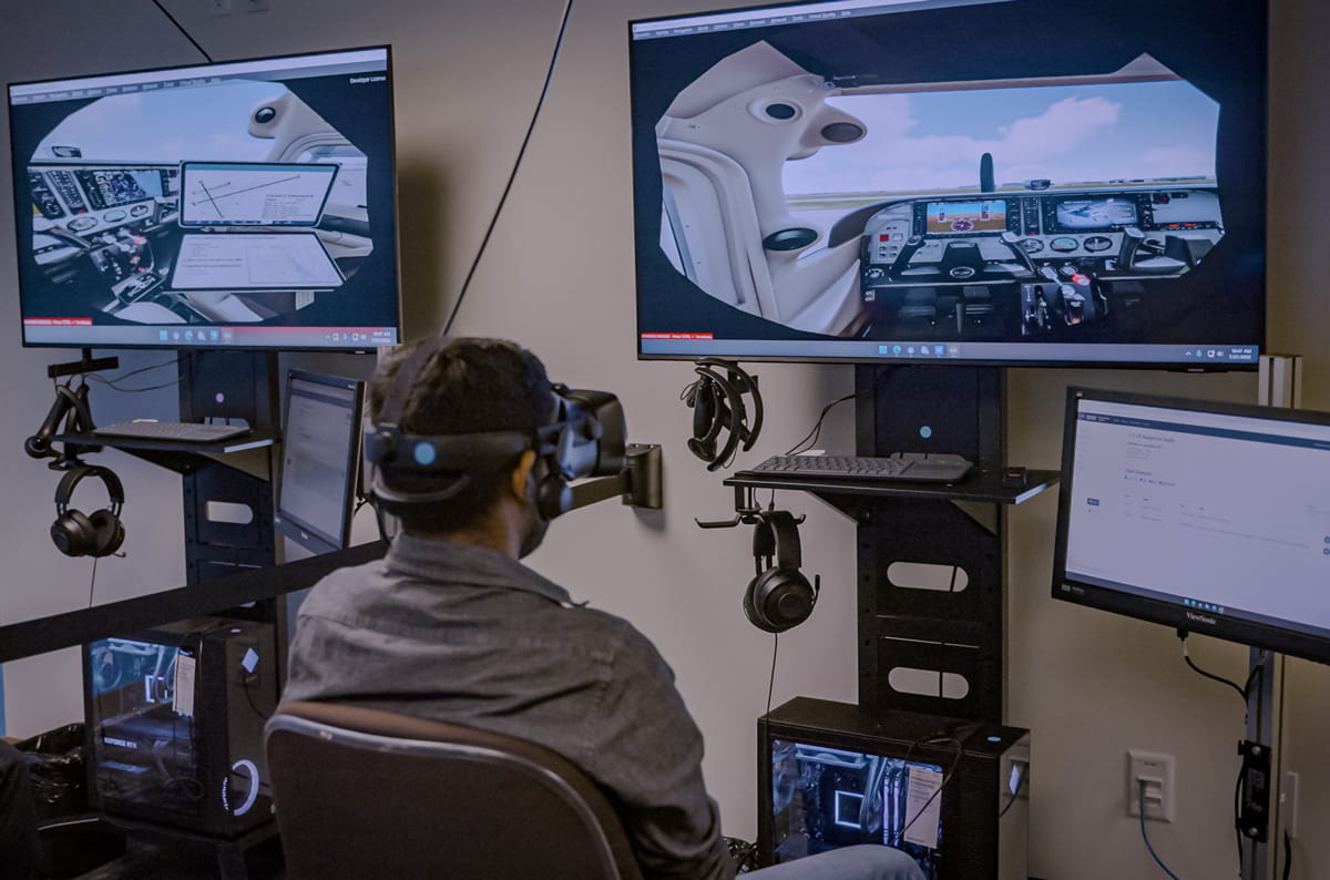 On a system in Embry‑Riddle’s Preflight Immersion Lab on the Daytona Beach Campus, a student practices radio communications by interacting with AI-driven air traffic control and pilots. (Photo: Embry‑Riddle)