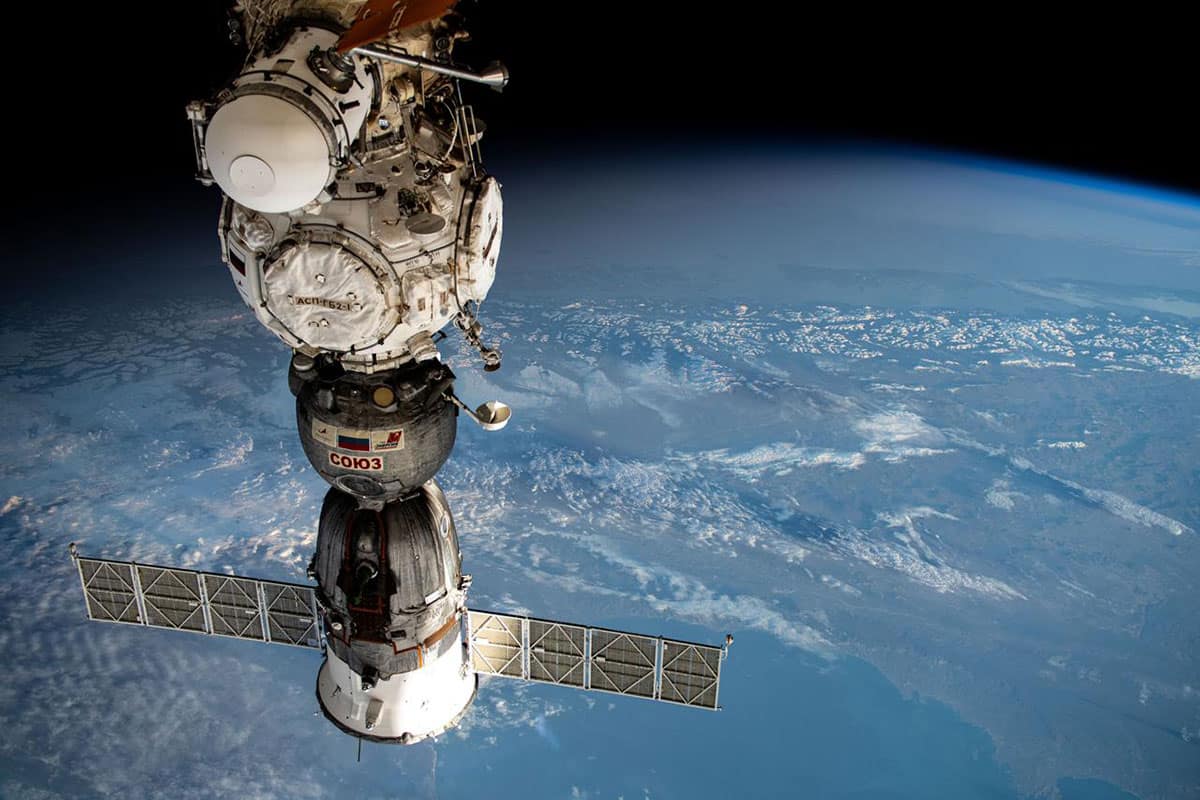 Recent work by Embry‑Riddle Aerospace Engineering researchers focuses on estimating changes in the mass properties of space vehicles as they exchange crew and cargo while in orbit. In this photo (from bottom to top), the Soyuz MS-25 crew ship is pictured docked to the Prichal docking module, which is attached to the Nauka science module of the International Space Station (ISS). The ISS was orbiting 266 miles above the South Atlantic Ocean off the coast of Argentina when this photograph was taken on May 15, 2024. (Photo: NASA)