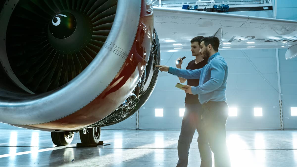 Members of the Aviation Supply Chain Integrity Coalition examine spare parts installed on a jet engine. (Photo: Courtesy of the Aviation Supply Chain Integrity Coalition)