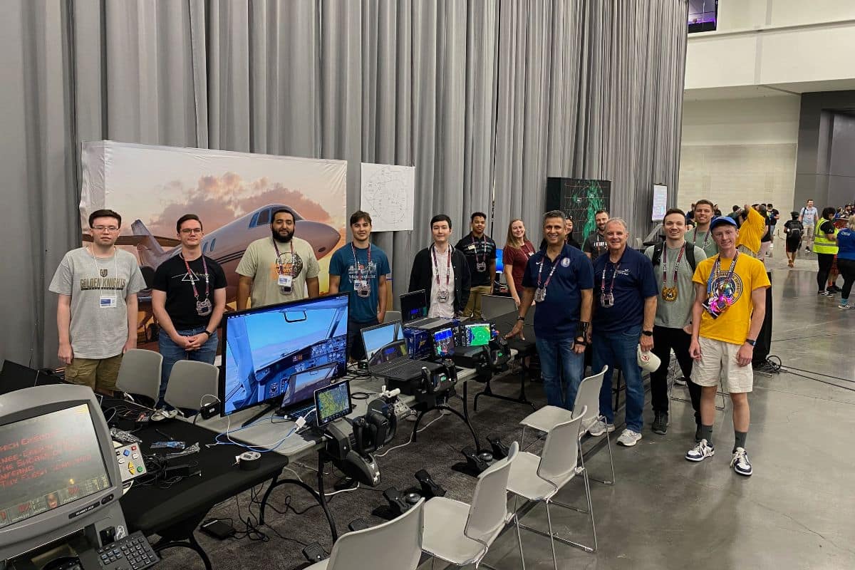Embry‑Riddle students who participated in the DEF CON cybersecurity conference had the opportunity to network with industry professionals. In this photo, from left to right, are students Nicholas Harris, Michael Boehm, Bernard Correa, Enzo Gonzalez, Trevor French, Christian Hardy and Carol Martin. Standing alongside Martin is Dr. Krishna Sampigethaya, department chair of Cyber Intelligence and Security; student Jennifer Hong; Kyle Wilkerson, assistant professor of Air Traffic Management; Jeffrey Troy, president and CEO of Aviation ISAC; Matt Crandell, IT Administrator at Aviation ISAC; and students Joshua Sawyer and Nathan Johnson. (Photo: Embry‑Riddle/Nathan Johnson)