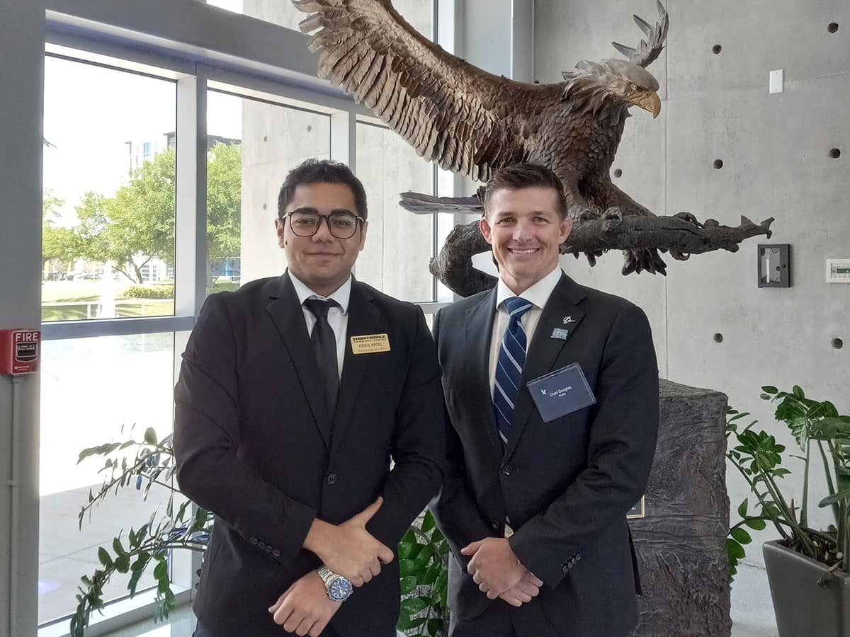 Aerospace Engineering senior Henil Patel (left) has been selected as a 2024-2025 Western Union Global Scholar by the Institute of International Education, the first time an Embry‑Riddle student has received the award. Patel stands with alumnus Chad Douglas, who encouraged him to join the Boeing Career Mentoring Program. (Photo: Embry‑Riddle/John Frankie)