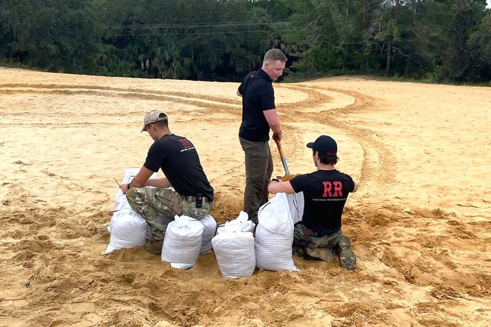 Embry-Riddle's Red Rope team loads sandbags to help prepare residents for Hurricane Milton. (Photo: Silas Riggs)