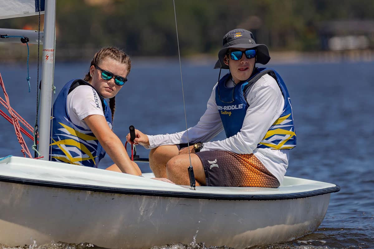 Embry‑Riddle students Paige Arneson (left) and Zechariah Frantz compete as part of the university’s Sailing Club. (Photo: Embry‑Riddle/Alex Chidester)
