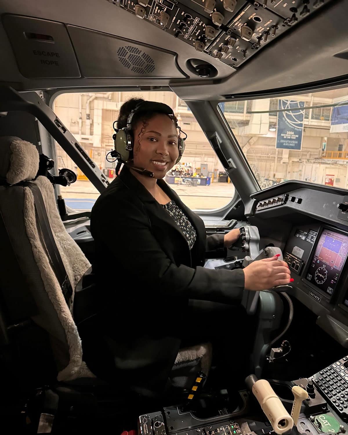 During her 2023 internship at Republic Airways, Aeronautics major Christa Foster checked out the flight deck of one of the company’s jets. (Photo: Christa Foster)