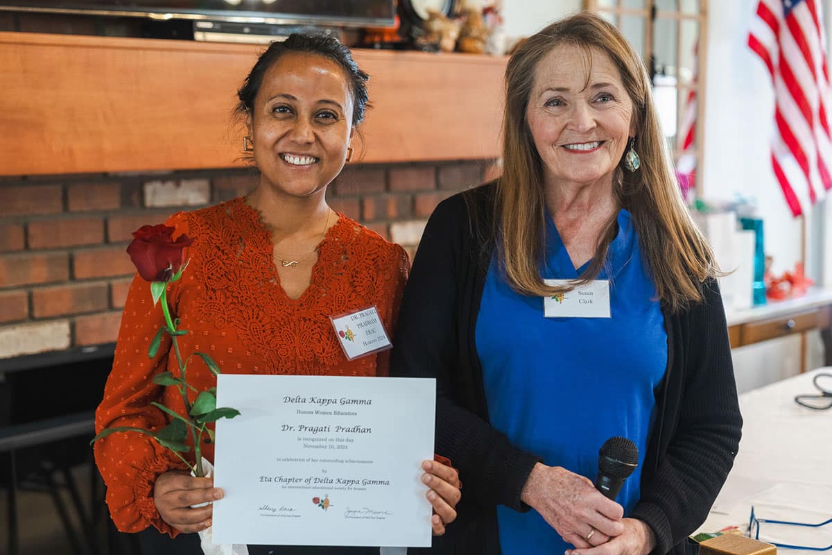 Dr. Pragati Pradhan (left), assistant professor of Physics and Astronomy, is recognized at an Honors Breakfast by the Delta Kappa Gamma Society International chapter in Prescott, Arizona. Next to her is the event’s keynote speaker Susan Clark, a retired elementary educator from the Chino Valley Unified School District. (Photo: Embry‑Riddle/Matthew Balinca)