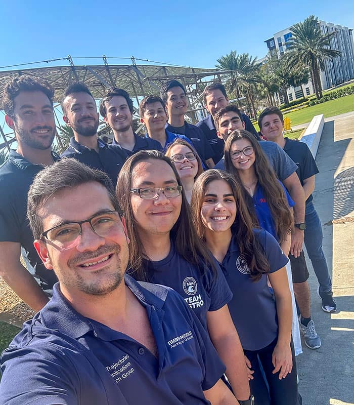 Professor David Canales Garcia poses with the members of his Space Trajectories and Applications Research STAR group, which has published several papers in prestigious journals. Bottom row: Canales, Justin Schmitt, Elena Vlaskovic, Annika Anderson, Kya Sedelmeyer, Drew Schachel, Luis Mendoza-Zambrano. Top row: Joseph Anderson, Edison Martinez, Brian Baker-McEvilly, Mauro Palomo, Seur Gi Jo, Franco Criscola. (Photo: Embry‑Riddle)
