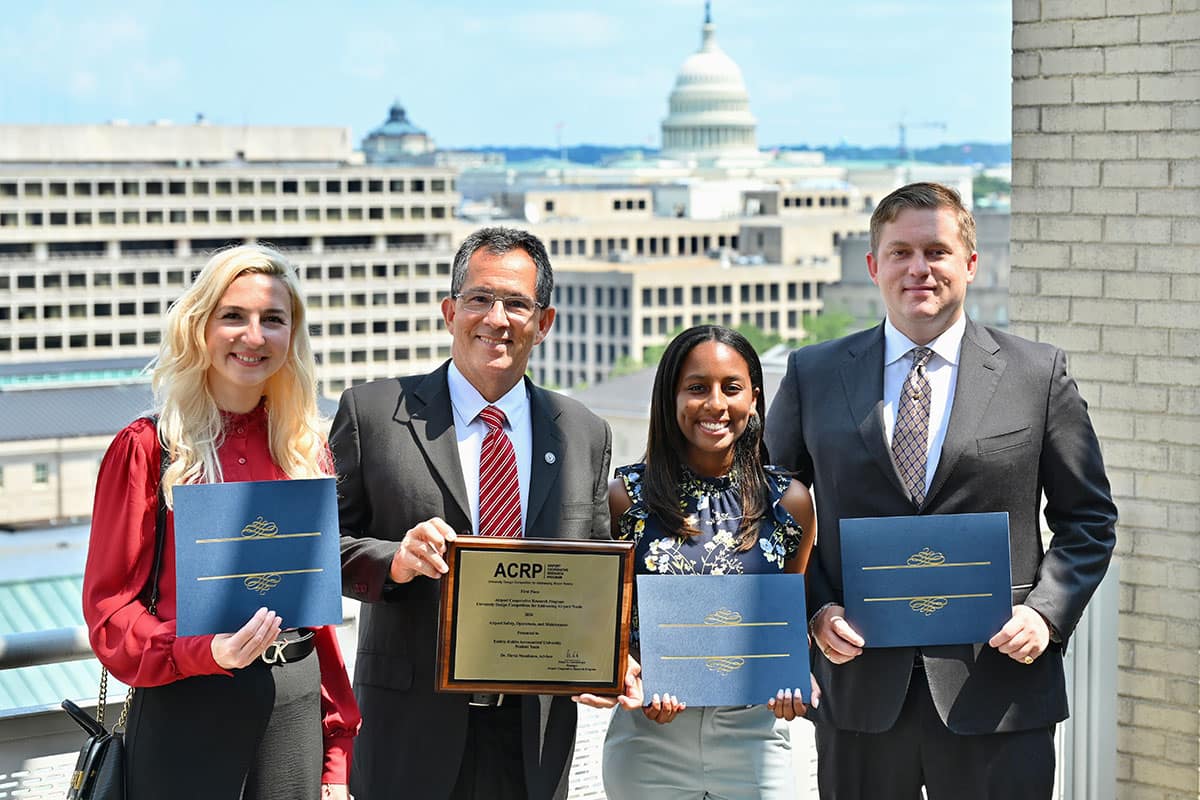 An Embry‑Riddle team — comprised of Anna Golendukhina, Dr. Flavio Mendonca, Savanna Box, Nicholas Buckalew and (not pictured) Raymon Ayres and Jose L. Cabrera — recently won first place for a research project focused on using uncrewed aircraft systems, or drones, to help mitigate the risk of wildlife hazards at airports. (Photo: ACRP Media Team)