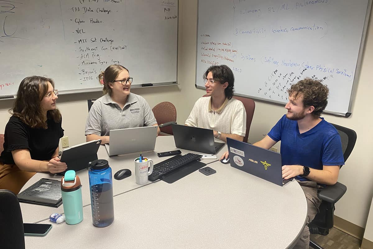 An Embry‑Riddle student team has been named to the top ten in the 2024 FAA Data Challenge. The team includes (pictured from left to right) Alexandra Davidoff, Sarah Reynolds, Daniel Machado and Luke Newcomb. (Photo: Embry‑Riddle/Sarah Reynolds)