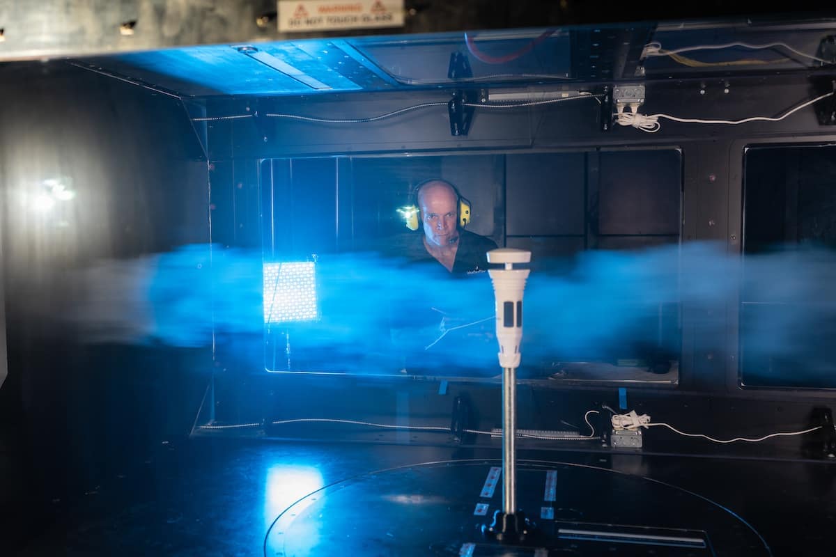 Embry‑Riddle Research Park Partner WeatherFlow-Tempest has moved its headquarters to the Research Park. In this image from 2019, David St. John, WeatherFlow-Tempest co-founder and chief technology officer, affixes the Tempest weather station inside the Subsonic Wind Tunnel Facility at the Research Park. (Photo: Embry‑Riddle/David Massey)