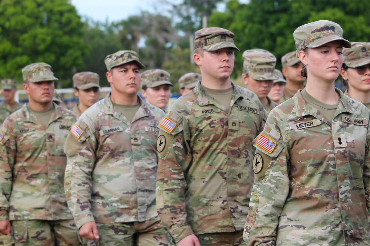 Embry-Riddle ROTC participants stand in lines in camouflage uniforms