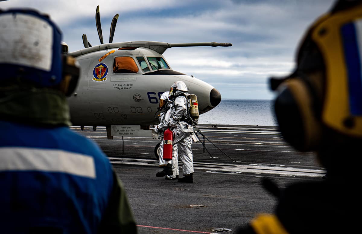 Sailors conduct firefighting training during a mass casualty drill on the flight deck of the aircraft carrier USS Nimitz (CVN 68) in the Pacific Ocean. (Photo: U.S. Navy photo by Mass Communication Specialist Seaman Anthony Lagunes)