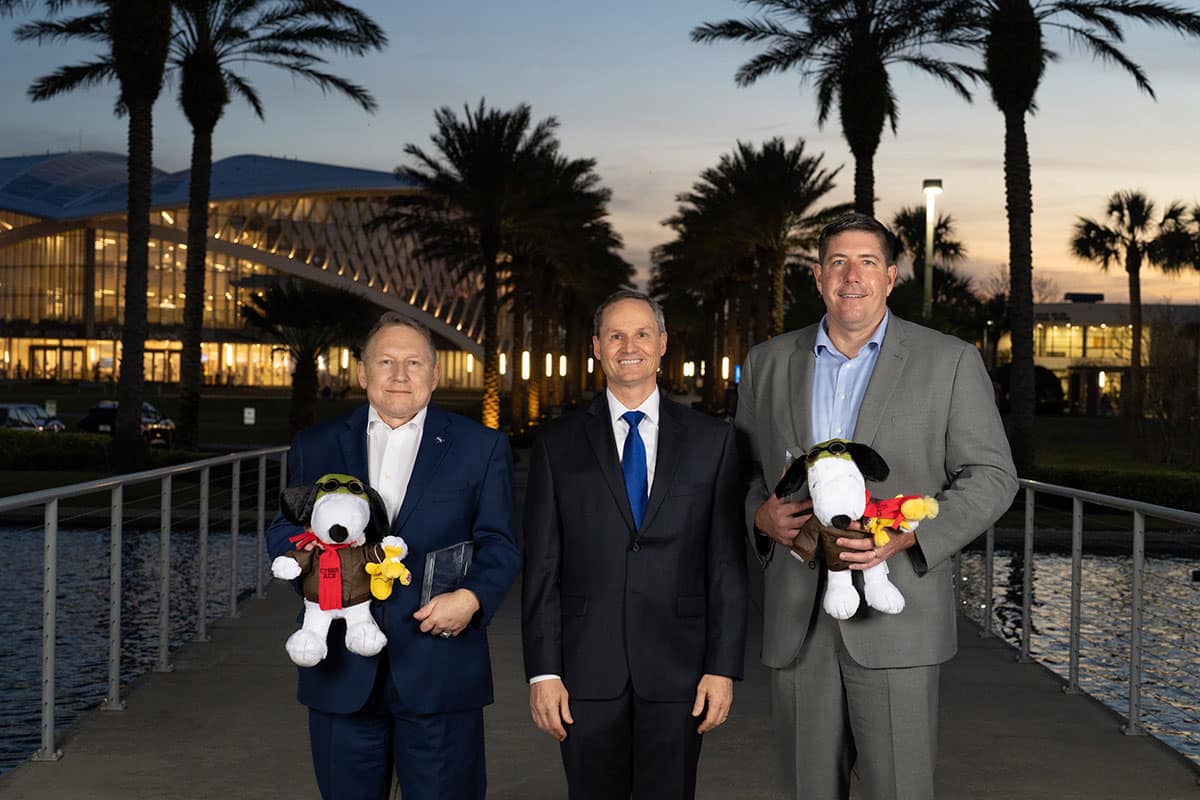 ACE Leadership Award winners Paul Hoyt Nelson (left) and Brian Connolly flank Dan Diessner, the executive director of Embry‑Riddle’s Center for Aerospace Resilient Systems. (Photo: Bernard Wilchusky/Embry‑Riddle)