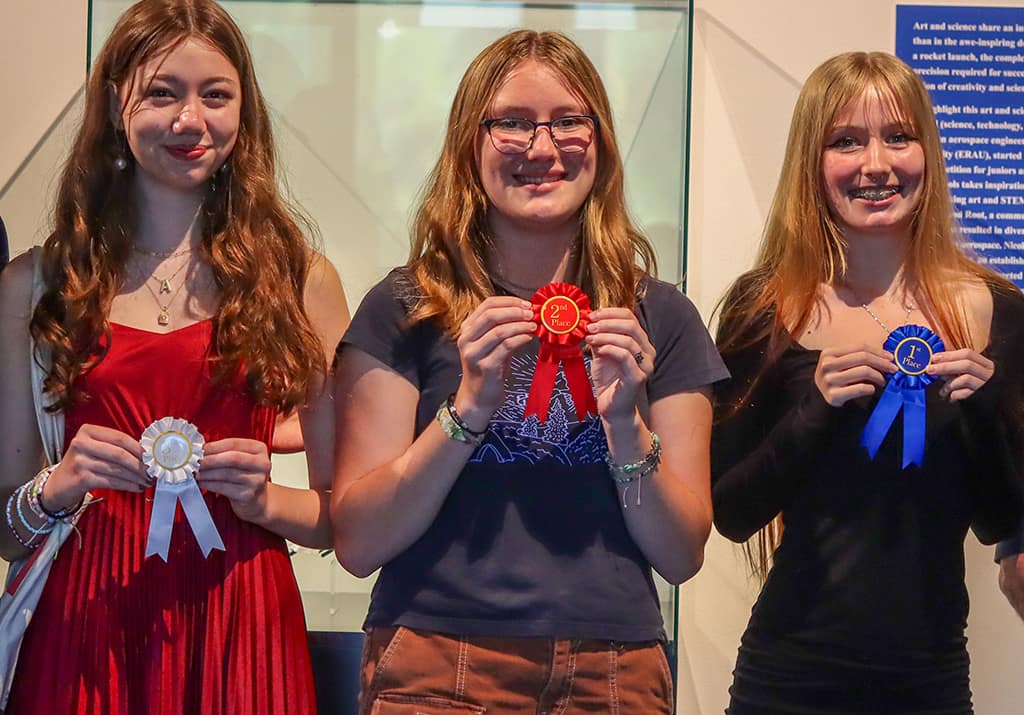 The 2024 Drive to Fly aerospace art competition winners included (left to right) Ava Werner, Sabrina Dahl and Aspen Redden.