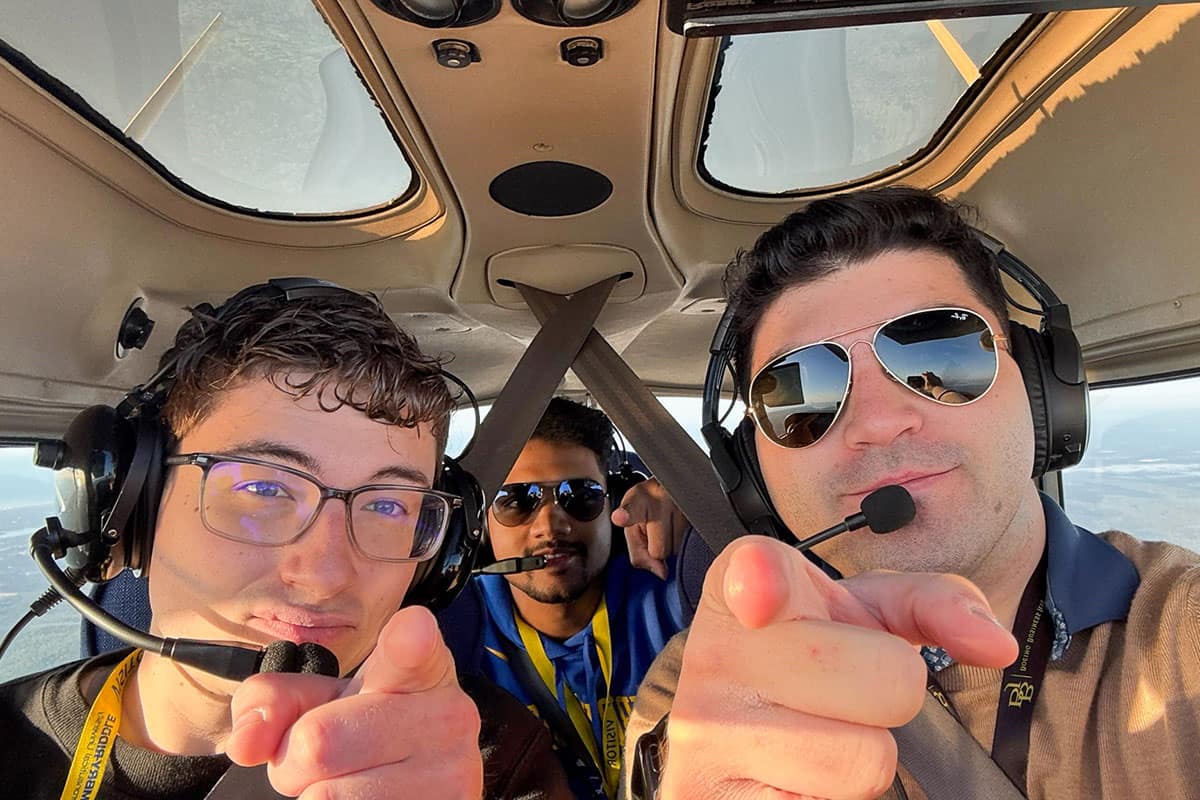 Embry‑Riddle Student Government Association presidents Christopher Sorensen, Sreenath “Sree” Vijayakumar and Ander Turueno Garcia fly over the Daytona Beach area. (Photo: Embry‑Riddle/Ander Turueno Garcia)