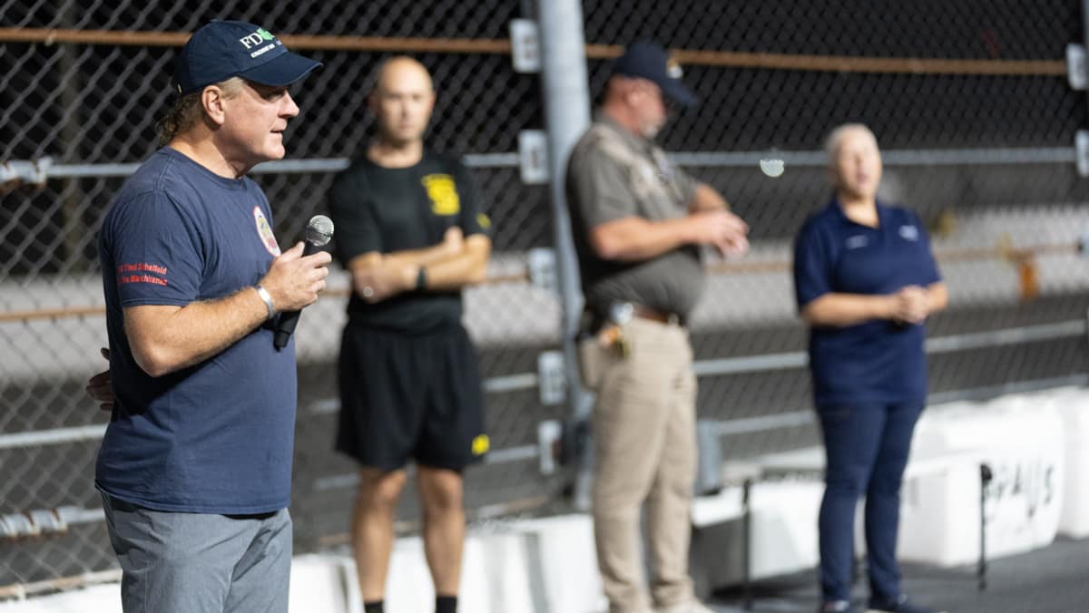 Frank Morrisey, who served as an FDNY firefighter on Sept. 11, addresses cadets and midshipmen before they begin their climb. (Photo: Embry‑Riddle/David Massey)