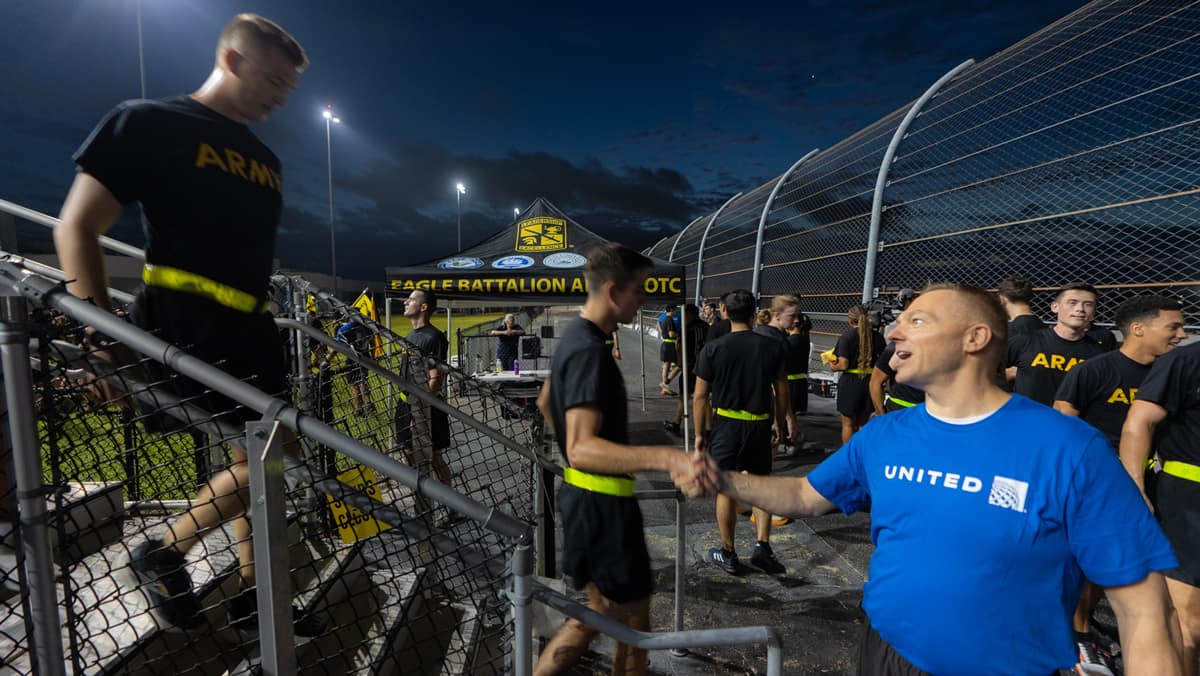 Captain Paul Ryder of United Airlines congratulates cadets as they finish the 9/11 memorial stair climb. (Photo: Embry‑Riddle/David Massey)