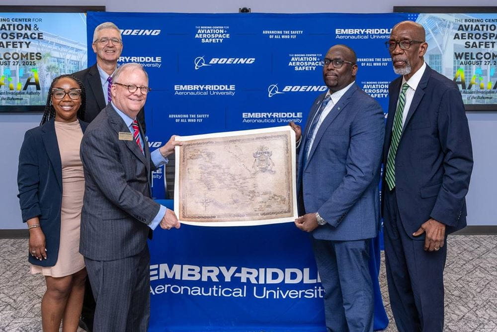 The AAIA of the Bahamas team presents a map to Sumwalt and Embry‑Riddle President P. Barry Butler. The team includes (from left) Aviation Safety Analyst Symonne Cargil; Kendall Dorsett Jr., chief investigator of Air Accidents; and Captain Patrick Rolle, chairman of the AAIA of the Bahamas. (Photo: Embry‑Riddle/Daryl Labello)