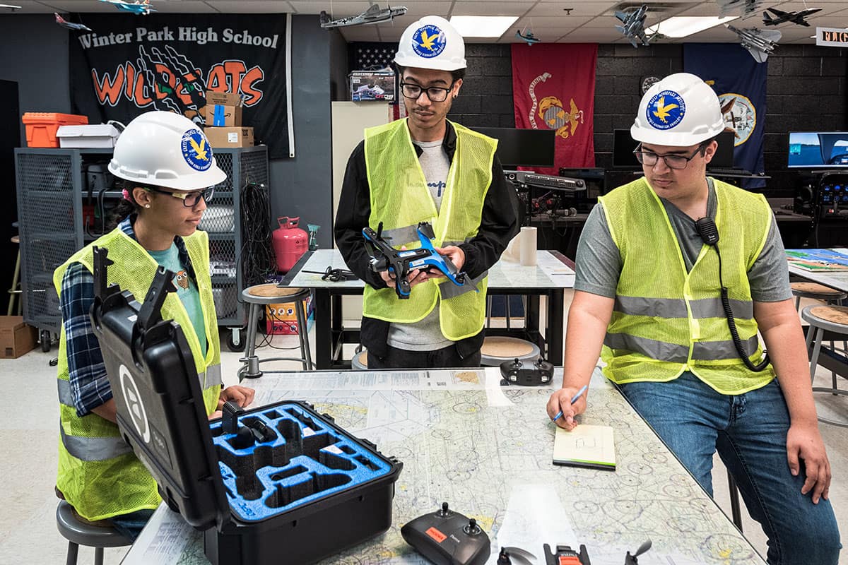Winter Park High School students Isabella Gutierrez, Aiden Williams and Robert Rosado work on a drone project as part of Embry‑Riddle’s Gaetz Aerospace Career Academy. (Photo: Embry‑Riddle/Jon Westberry)