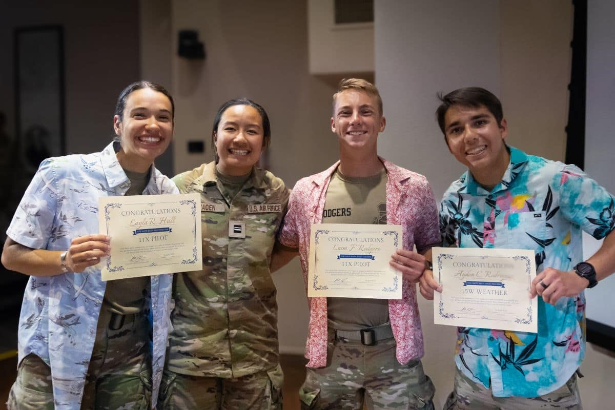 Air Force ROTC Detachment 028 cadets (from left) Layla Hull, Emma Layaoen, Liam Rodgers, and Ayden Rodriguez celebrate earning their assignments at Drop Night. (Photo: C/Capt Adrian Diaz)