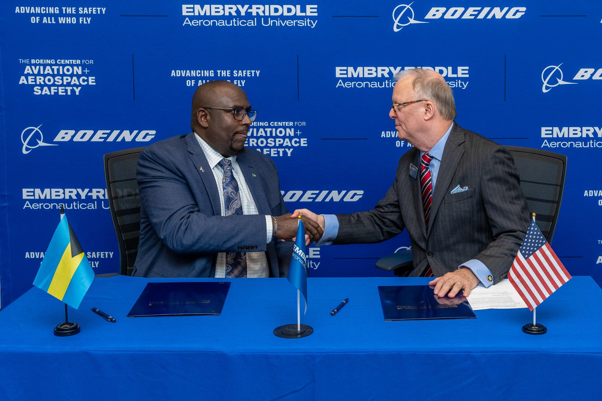 Kendall Dorsett Jr., chief investigator of Air Accidents at the AAIA of the Bahamas, and Robert Sumwalt, executive director of the Boeing Center for Aviation and Aerospace Safety, sign a memorandum of understanding to make Embry‑Riddle the official training partner of the AAIA. (Photo: Embry‑Riddle/Daryl Labello)