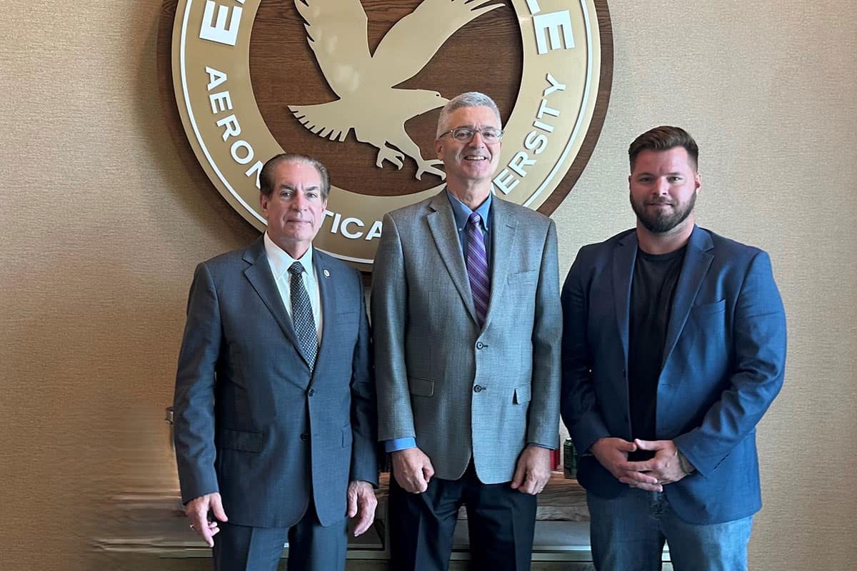 Embry‑Riddle President P. Barry Butler (center) stands with Florida Senator Tom Wright (left) and USNDA President Nathan Ecelbarger (right) (Photo: Rodney Cruise)