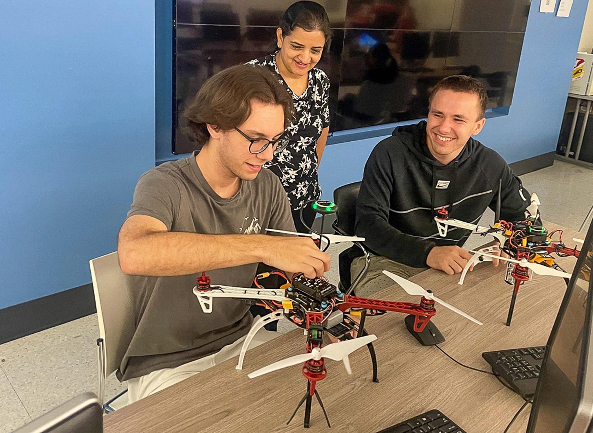 Embry‑Riddle students Nicolas Machado and Kyrylo Holovenko work with Dr. Laxima Niure Kandel, who led this summer’s National Science Foundation Research Experience for Undergraduates (REU) at the Daytona Beach Campus. (Photo: Embry‑Riddle/Melanie Stawicki Azam)