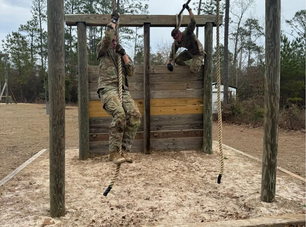 Cadet Patrick Irvine and Cadet Theodore Race navigate the Ft. Moore, Georgia, obstacle course during the 2024 6th Brigade Ranger Challenge Competition. (Photo: Army ROTC Public Affairs Officer)