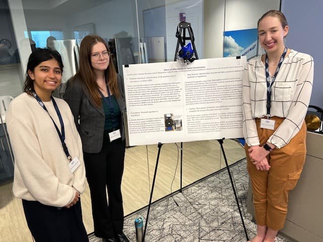 Students (L-R) Spoorti Nanjamma, Hannah Lyons and Cecilia Zoutewelle shared a poster about the effects of mild hypoxia on spatial disorientation, a usually fatal consequence of unusual gravitational forces in flight. The research, supervised by faculty member John French, also included students Amanda Dhanpaul, Haley Picciolo, Kiernan McNamara, Shenya Patrice, Ezra O’Connell and Gavin Weinheimer. (Photo: Embry‑Riddle/Ginger Pinholster)