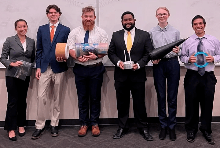 Team Imhotep, one of more than two dozen presenting teams, poses with their senior design project.