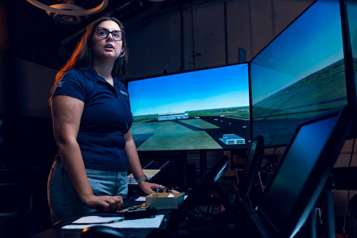 Embry‑Riddle student Magdalena Kokenge performs an air traffic simulation exercise in the new Air Traffic Control Laboratory on the Prescott Campus. Graduates of the Air Traffic Management program can now be fast-tracked into towers for on-the-job training. (Photo: Embry‑Riddle/Connor McShane and Wilson Van Ness)
