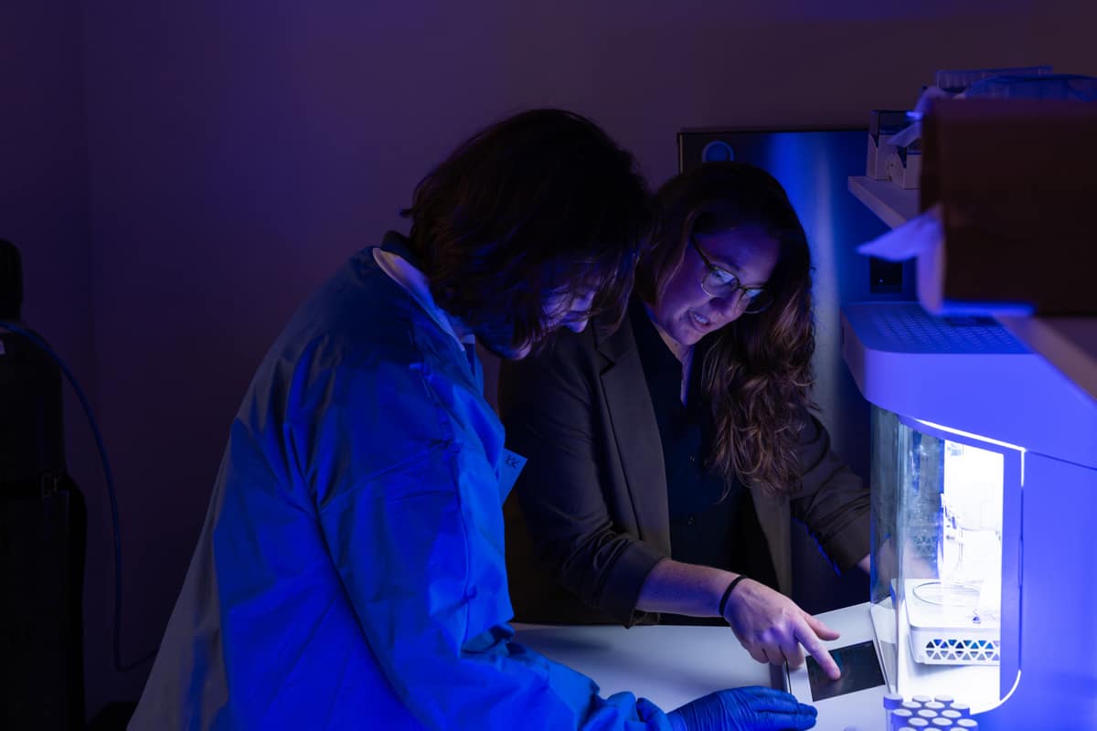 Embry-Riddle teacher shows student how to use a 3D bioprinter.