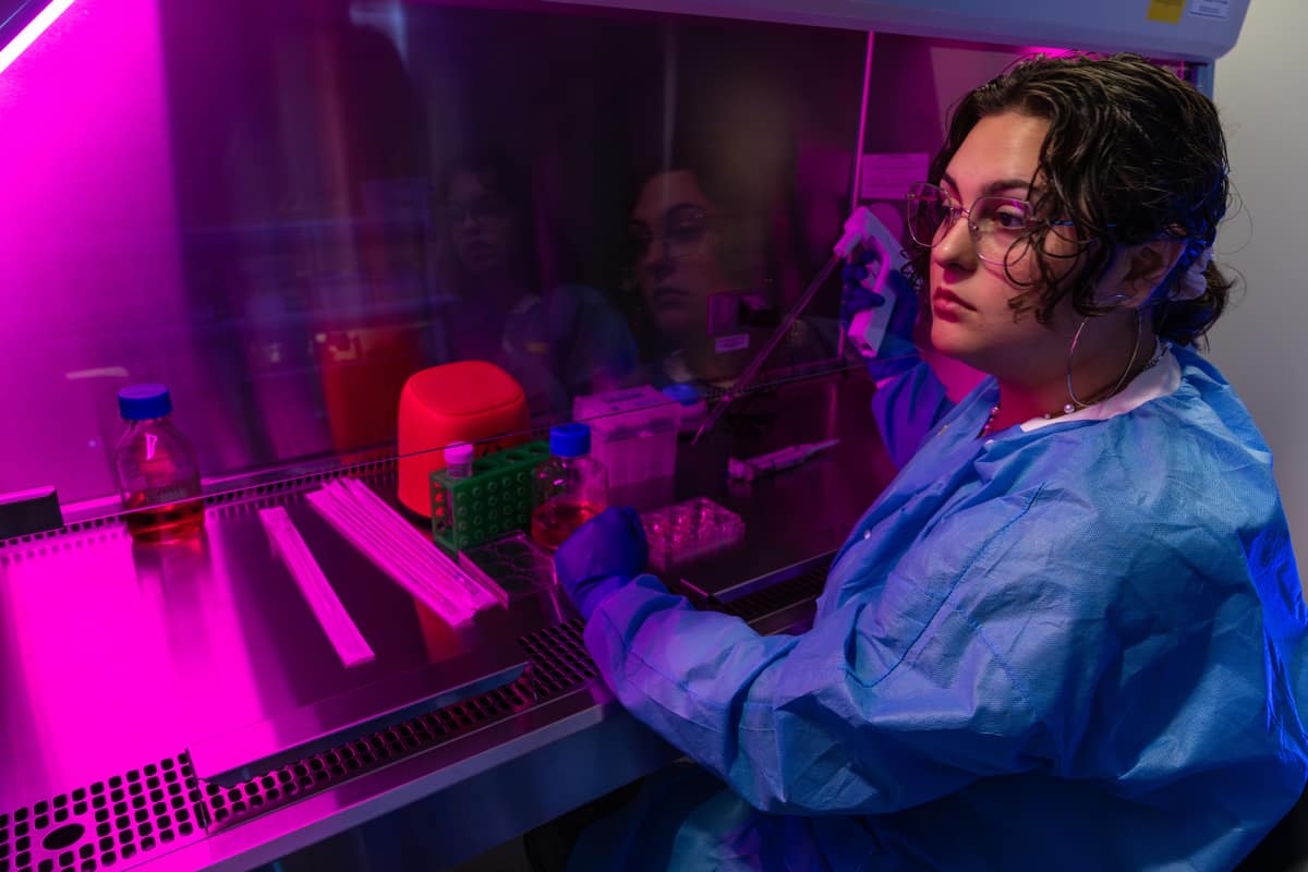 Embry-Riddle student Mariposa Magee uses a biosafety cabinet.