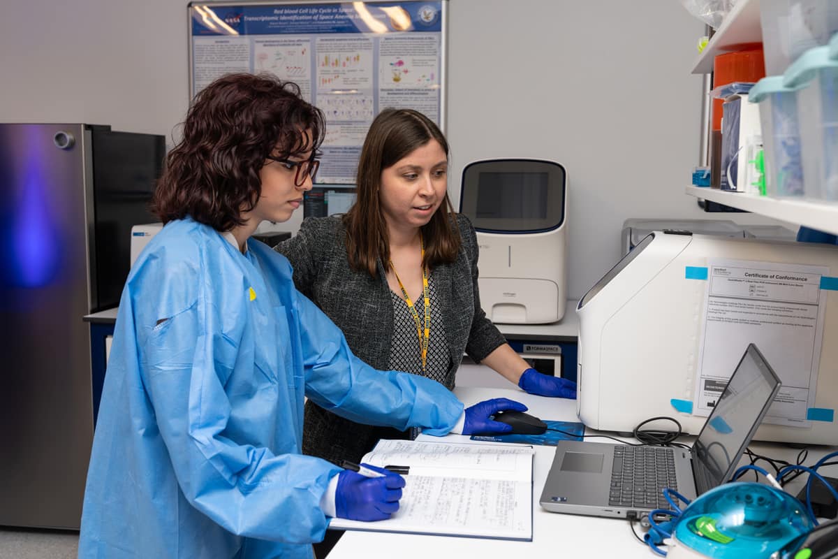 Embry-Riddle professor Dr. Sen Kilic works with a student.