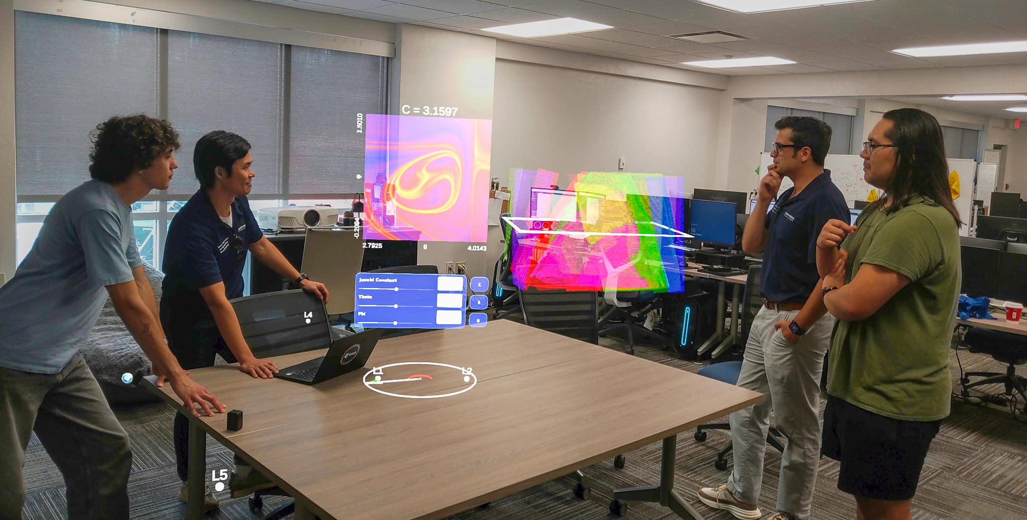 Dr. David Canales examines a visualization of possible trajectory behaviors.