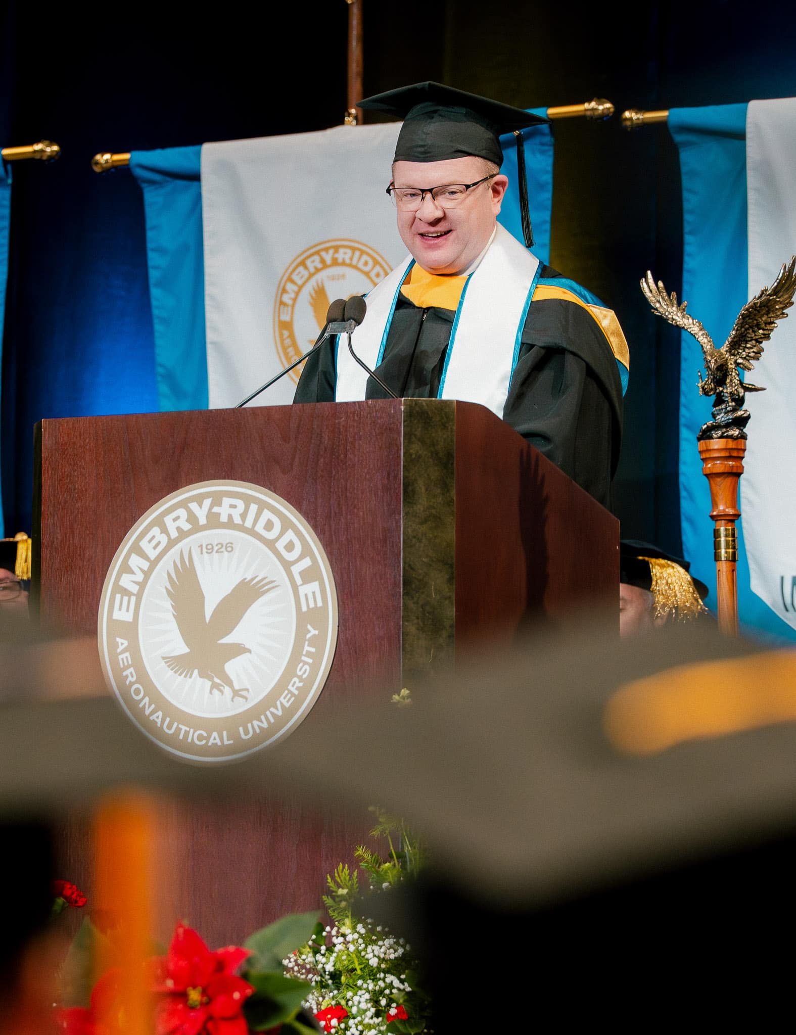 Chris Sembroski speaking at commencement ceremony,