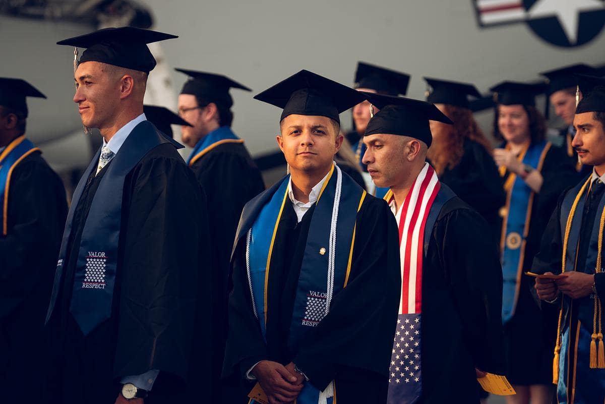 An Embry-Riddle student walks during graduation
