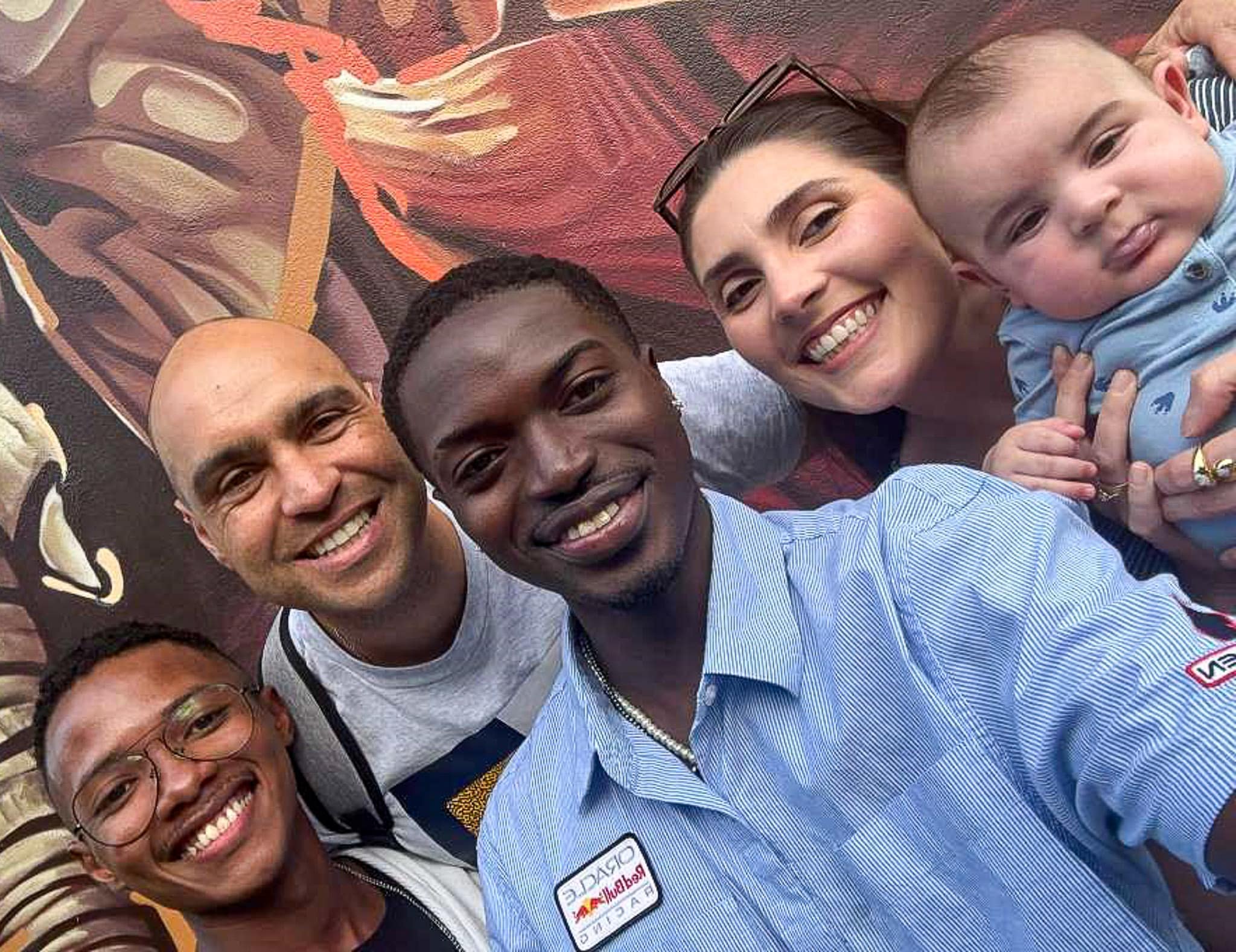 Embry‑Riddle conversation partner Chad Willock takes a photo in São Paulo with Brazilian controllers Neto and Flávia Margiota (right) and their baby Alvaro. Aurélio Melo, another of his students, is also pictured on the far left. (Photo: Embry‑Riddle/Chad Willock) Chad Willock pictured with Brazillian controllers Neto and Flávia Margiota